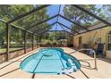 Inviting screened-in pool area, perfect for relaxing and entertaining in a private backyard setting at 6150 Nw 59Th Ave, Ocala, FL 34482
