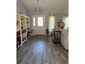 Inviting foyer with stylish lighting and ample shelving for storage at 7407 Sw 202 Ct, Dunnellon, FL 34431