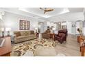 Open-concept living room with a decorative rug and comfortable furniture at 9573 Sw 79Th Loop, Ocala, FL 34481