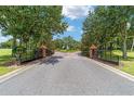 Elegant gated entrance to Irish Acres with brick pillars and lush landscaping creating a sense of arrival at 1784 Nw 85Th Loop, Ocala, FL 34475