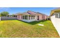 View of the home's backyard and screened-in lanai area, offering a relaxing outdoor space at 2935 Sw 41St Pl, Ocala, FL 34474