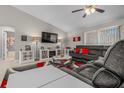 Inviting living room with plush sectional, stylish decor, and a view into the adjacent bathroom at 7886 Sw 103Rd Loop, Ocala, FL 34476
