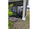 A screened porch with a view of the backyard showcasing outdoor living space at 9326 Sw 57Th Ter, Ocala, FL 34476