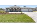 Beautiful single-story home features a stone-accented porch and a manicured lawn at 9973 Sw 107Th Ter, Ocala, FL 34481