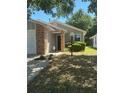 Charming home with brick accents, mature landscaping, and a well-maintained lawn at 2127 N.E. 40Th Ave., Ocala, FL 34470