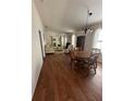 Open-concept living area features hardwood floors and comfortable seating arrangement at 2127 N.E. 40Th Ave., Ocala, FL 34470