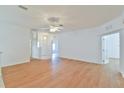 Spacious living room with wood flooring, neutral walls, and an open layout, creating a versatile living space at 2339 Nw 55Th Avenue Rd, Ocala, FL 34482
