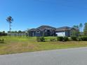 Attractive single-story home with arched entryway and manicured lawn at 4770 Sw 114Th St, Ocala, FL 34476