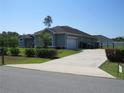 Charming single-story home featuring an attached garage and well-manicured landscaping at 4770 Sw 114Th St, Ocala, FL 34476