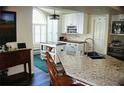 Modern kitchen featuring granite countertops, stainless steel appliances, and ample cabinet space at 5281 Sw 33Rd St, Ocala, FL 34474