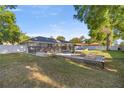 Large backyard featuring a deck, privacy fence, and landscaping at 8215 Sw 53Rd Ct, Ocala, FL 34476
