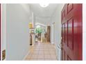 Warm, inviting entryway showcasing tile flooring, leading to a dining area bathed in natural light at 11133 Sw 73Rd Ter, Ocala, FL 34476