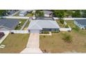 Lovely home featuring a fenced backyard, screened-in pool and spacious yard with mature landscaping at 1453 Ne 161St Pl, Citra, FL 32113