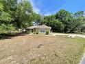A single-story house with a well-maintained lawn at 26 Hemlock Circle Way, Ocala, FL 34472