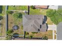 Birds-eye view of home with fenced backyard, mature trees, trampoline, and convenient access to the street at 3970 Sw 51St Ter, Ocala, FL 34474