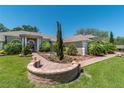 Attractive home featuring a brick walkway, mature landscaping, and a stately front entrance at 5090 Nw 80Th Avenue Rd, Ocala, FL 34482