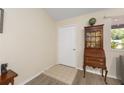 Cozy entryway featuring a vintage cabinet and tile transition at 8237 108Th Street Sw Rd, Ocala, FL 34481