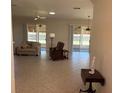 Spacious living room with tiled floors and lots of natural light at 9288 Sw 93Rd Cir, Ocala, FL 34481