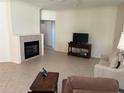 Living room features tile flooring, a fireplace, and comfortable furniture at 9288 Sw 93Rd Cir, Ocala, FL 34481