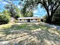 View of the home's front exterior showcasing the well-maintained lawn and charming curb appeal at 1145 Se 32Nd Ave, Ocala, FL 34471