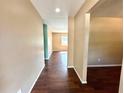 Hallway showing laminate floors and access to other rooms at 1145 Se 32Nd Ave, Ocala, FL 34471