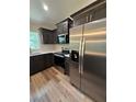 Close up of modern kitchen featuring stainless steel appliances and wooden cabinets at 13506 Sw 114Th Ln, Dunnellon, FL 34432