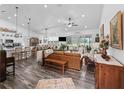 Spacious open-concept living room with hardwood floors and abundant natural light at 2780 Ne 127Th Pl, Anthony, FL 32617