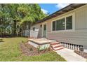 Front exterior of charming home with well-maintained lawn and tidy front garden at 4180 W Anthony Rd, Ocala, FL 34475