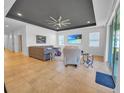 A spacious living room featuring recessed lighting, a ceiling fan, and neutral decor at 5198 Ne 19Th Pl, Ocala, FL 34470