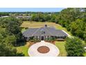 Stunning home with a circular driveway and beautiful landscaping at 5484 Sw 30Th Ave, Ocala, FL 34471