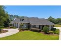 Beautifully landscaped front yard leading to an inviting home at 5484 Sw 30Th Ave, Ocala, FL 34471
