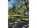 Two-story condo building with well-maintained lawn and landscaping in a quiet location at 571 Midway Trak # J202, Ocala, FL 34472