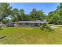 Charming single-story home with well-maintained lawn, landscaping, cozy front porch and lovely bay window at 6318 Nw 52Nd Ave, Ocala, FL 34482