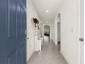 Inviting entryway with tile flooring and a glimpse into the home's interior at 716 Hickory Course Loop, Ocala, FL 34472
