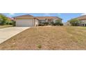 Inviting single-story home with a manicured lawn and cozy curb appeal at 8127 Sw 60Th Ct, Ocala, FL 34476