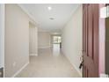 Welcoming foyer with neutral tones and tiled flooring at 8952 Sw 79Th Ln, Ocala, FL 34481