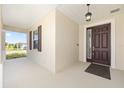 Inviting covered front porch and stylish front door at 8952 Sw 79Th Ln, Ocala, FL 34481