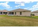 A view of the backyard, which features a screened in porch at 9175 Se 118Th Loop, Summerfield, FL 34491