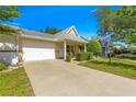 Charming single-story home with a well-maintained lawn, white garage door, and inviting front porch at 9638 Sw 94Th Ave # C, Ocala, FL 34481