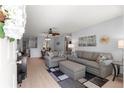 Bright living room with plush seating, stylish decor, and modern ceiling fan, perfect for relaxing at 9638 Sw 94Th Ave # C, Ocala, FL 34481
