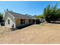 Well-maintained home with a classic design featuring a newer roof and windows surrounded by a grassy yard at 15069 Se 73Rd Ave, Summerfield, FL 34491