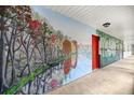 Hallway featuring a colorful nature-themed mural, adding charm and character at 16891 Ne 243Rd Place Rd, Fort Mc Coy, FL 32134