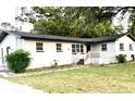 Inviting single-Gathering home showcasing a charming front porch, multiple windows, and a well-manicured lawn at 2138 Sw 9Th Rd, Ocala, FL 34471
