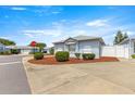 Corner lot features well-maintained shrubs and decorative ground cover at 3017 Moultrie Way, The Villages, FL 32162