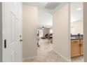 Inviting foyer with tile floors leading to the open living spaces of the home at 3017 Moultrie Way, The Villages, FL 32162