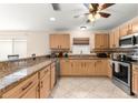 Spacious kitchen with granite countertops, stainless steel appliances, and ample cabinet space at 3017 Moultrie Way, The Villages, FL 32162
