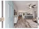 Open-concept living space with modern wood flooring and a stylish decor at 13571 Sw 79Th Terrace Rd, Ocala, FL 34473