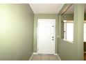 Entryway with a white door and tile flooring at 16 Water Trak, Ocala, FL 34472