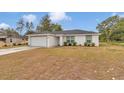 Attractive one-story home with a two-car garage, well-kept landscaping, and a sealed driveway at 16848 Sw 41St Avenue Rd, Ocala, FL 34473