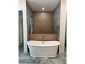 Luxurious bathroom featuring a sleek soaking tub, wood accents, and modern fixtures at 18890 Sw 60Th St, Dunnellon, FL 34432